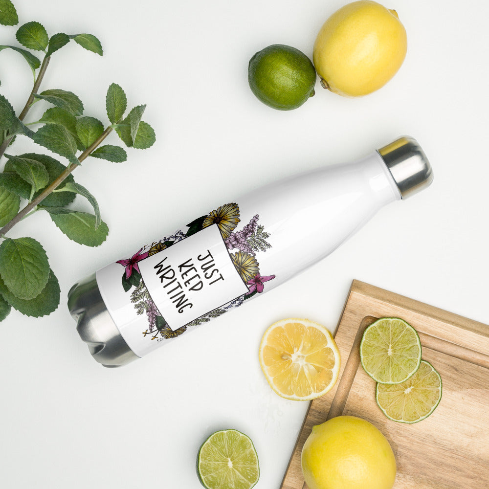 A white stainless steel water bottle for writers. Text within a floral illustrated frame reads "Just Keep Writing"